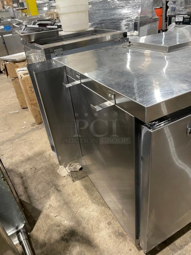 Continental Stainless Steel Refrigerated Prep Table, Model RA68NB, 2-1/2 doors, poly-coated rack, on casters, 115V.