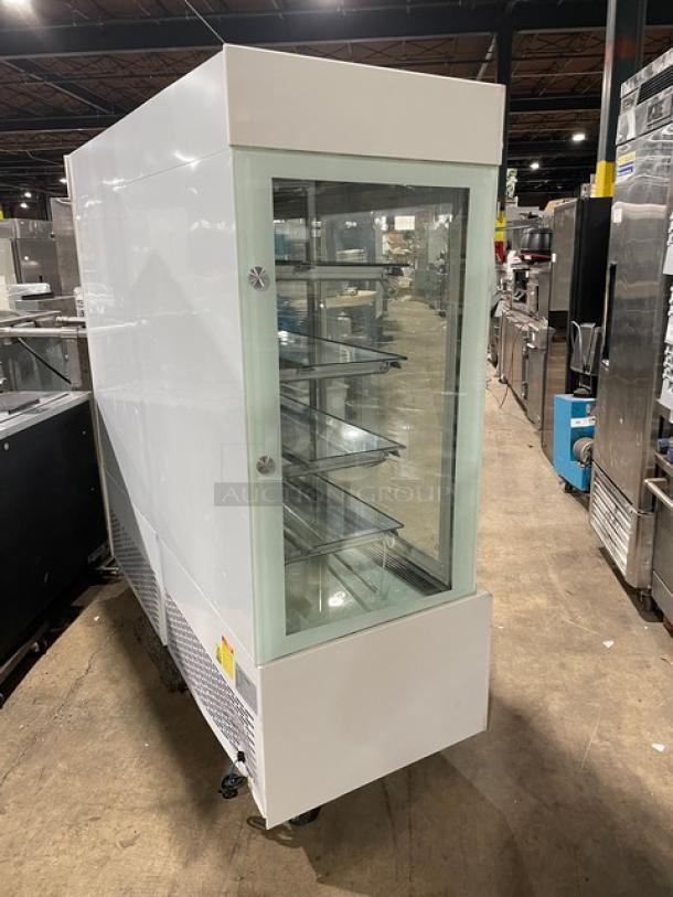 Commercial white multi-tier refrigerated bakery display with double glass sliding doors, Model ZSG-LLQ18, 220V.