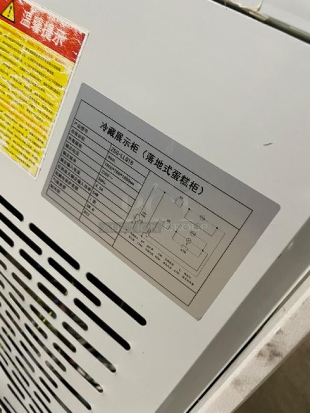 Commercial white multi-tier refrigerated bakery merchandiser model ZSG-LLQ18, with double glass sliding doors, 220V.