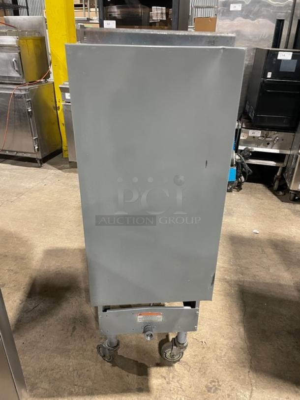 Pitco Frialator 40DSM commercial fryer, natural gas, 40 lb capacity, stainless steel, with backsplash, on casters.