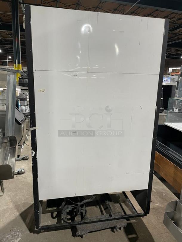 True GDM-41 commercial black double glass sliding door refrigerator; includes pusher glide bottle organizer; 115V 1 Phase.