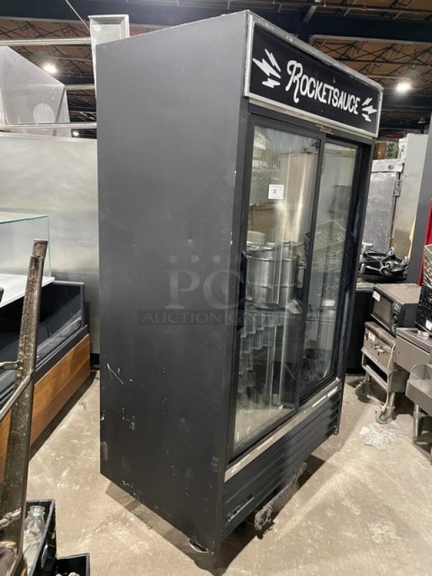 True Commercial black double glass sliding door merchandiser refrigerator, model GDM-41, with pusher glide organizer.