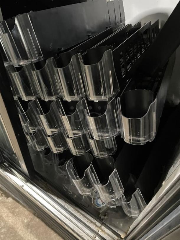 True GDM-41 commercial refrigerator, black double glass sliding doors, pusher glide bottle organizer, model SN: 570537, 115V.