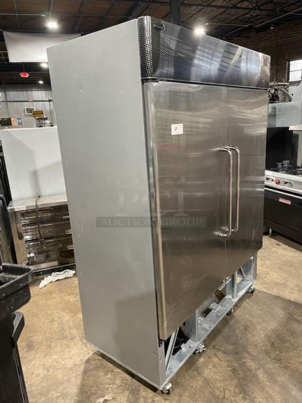 Fogel CR-49-SDF commercial stainless steel 2-door reach-in freezer with poly-coated wired rack on casters, model SN: 140310270.