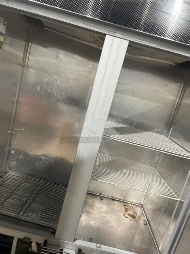 Fogel stainless steel commercial freezer, model CR-49-SDF, with poly-coated wired rack, on casters. Interior view.