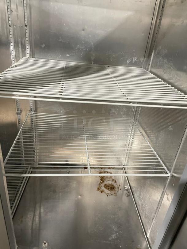 Fogel CR49SDF commercial freezer interior with poly-coated wire racks, stainless steel finish, and visible rust spots.