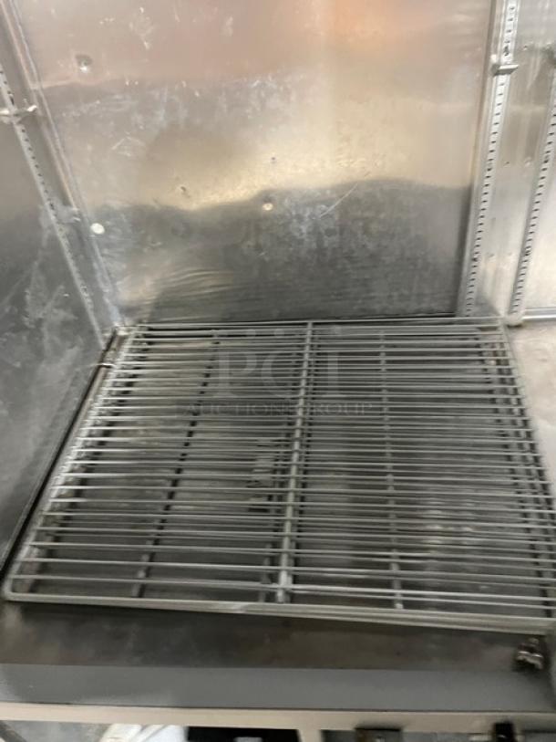 Fogel CR-49-SDF commercial freezer interior with poly-coated wire rack and stainless steel finish. Model visible on label. 