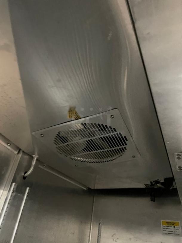 Fogel CR-49-SDF commercial stainless steel 2-door reach-in freezer interior, featuring a poly-coated wired rack and fan.