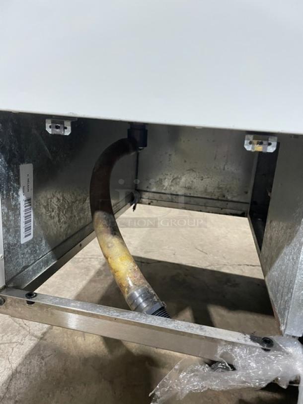 Commercial white curved glass horizontal ice cream dipping cabinet, rear lift-open access, visible hose connection, SN: N1902303.