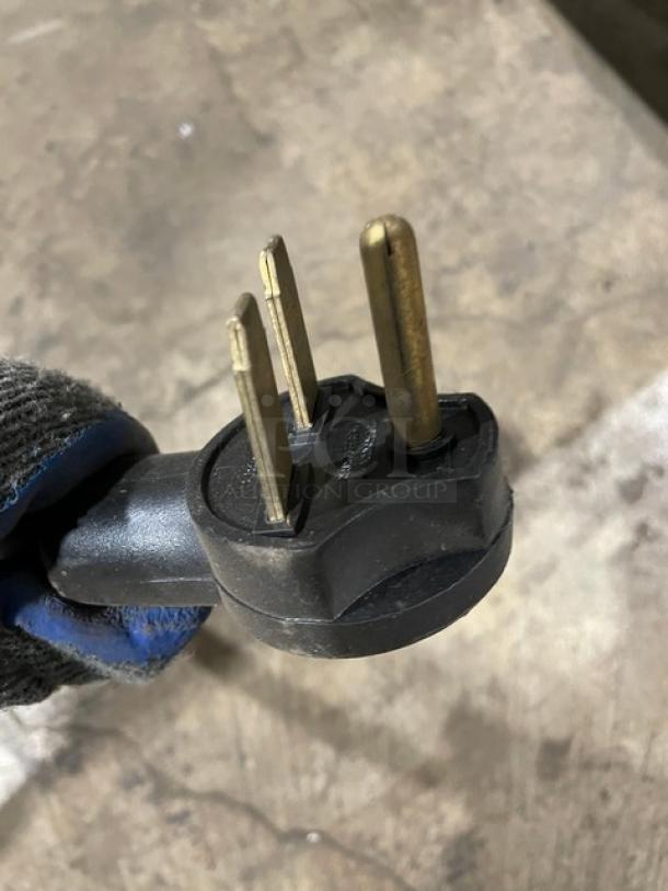 Close-up of a three-prong plug for a TurboChef NGO commercial rapid cook oven, 208/240V, 1 phase, 2015 model.