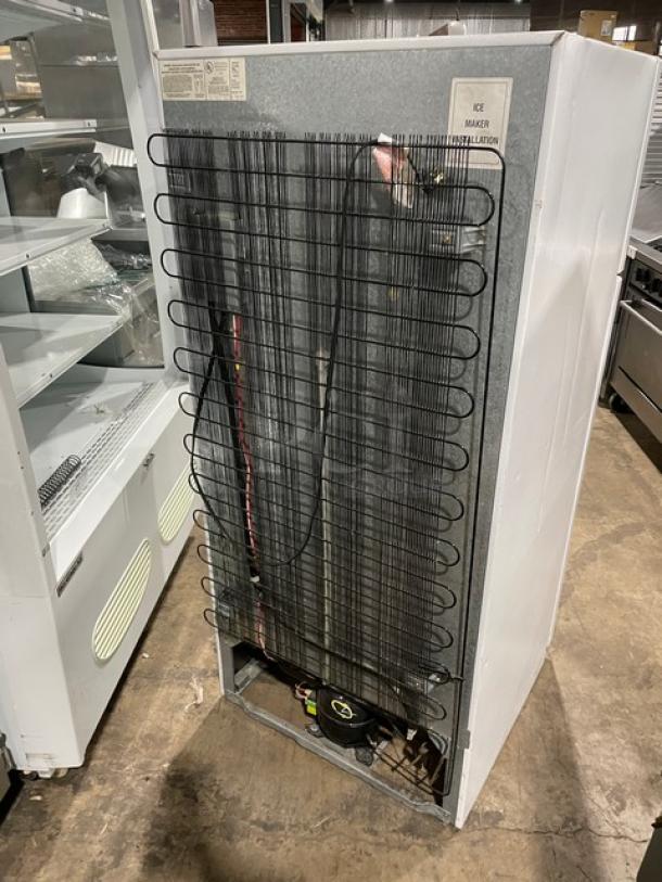 Commercial top-freezer refrigerator, model MRT18DNEWO, poly-coated wire racks, pull-out drawers, 115V, back view with coils.