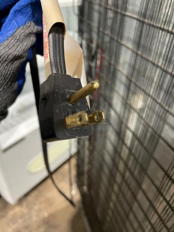 Commercial white top-freezer refrigerator combo, model MRT18DNEWO. Features poly-coated wire racks and pull-out drawers. 115V plug shown.