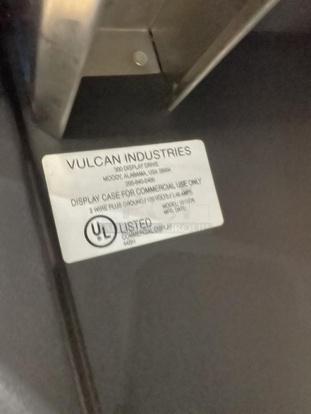 Vulcan Model 1013776 black 5-tier lighted bakery display with stainless steel interior and enclosed storage; UL listed.