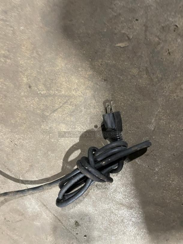 Plug of Vulcan model 1013776 bakery merchandiser display, 120V, shown on the floor.