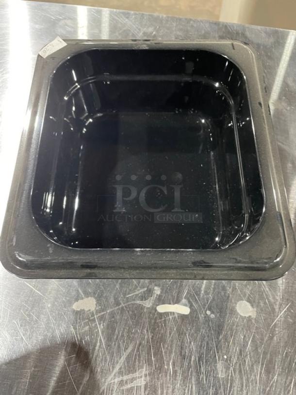 Cambro black 1/6-size food pan, 2.5" deep, new condition, ideal for commercial use. Tags indicate authenticity.