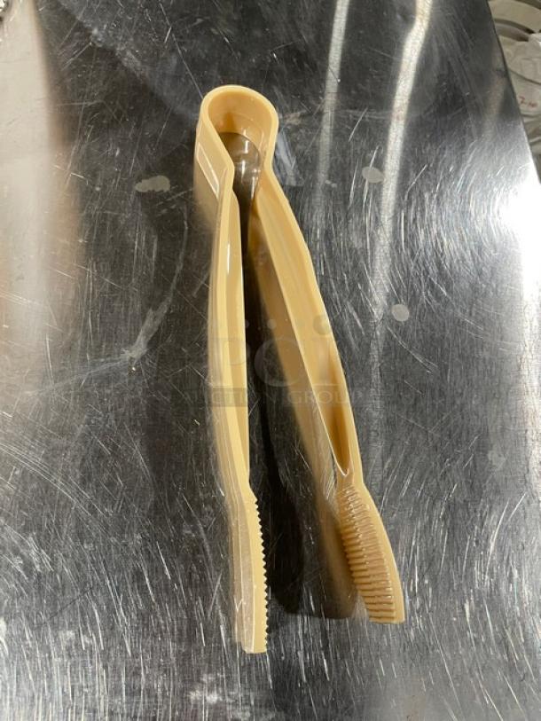New Cambro Commercial Beige 9" Flat Serving Tongs, Model TG9133, in excellent condition on a stainless steel surface.