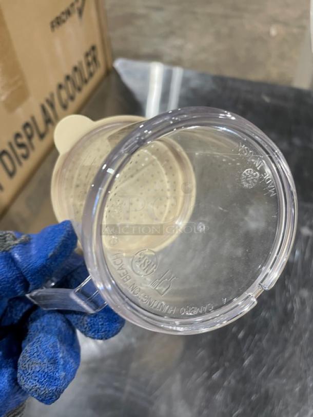 Cambro Camwear 10 oz. clear polycarbonate shaker/dredge, model 96SKRD135, with lid. New condition, visible markings show "Made in USA."