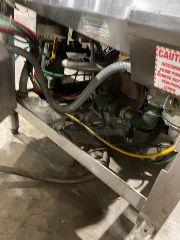 American Dish Service ET Series undercounter dishwashing machine, stainless steel, on legs, 120V, SN: WWS080206, visible wiring.