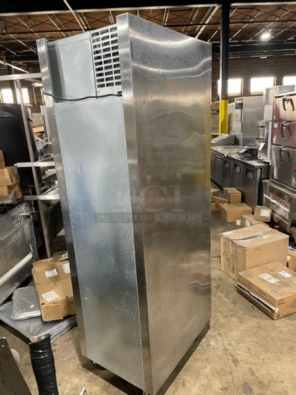 Traulsen stainless steel reach-in refrigerator, model AHT132DUT-HHS, single section, half door, with wired racks, on casters.