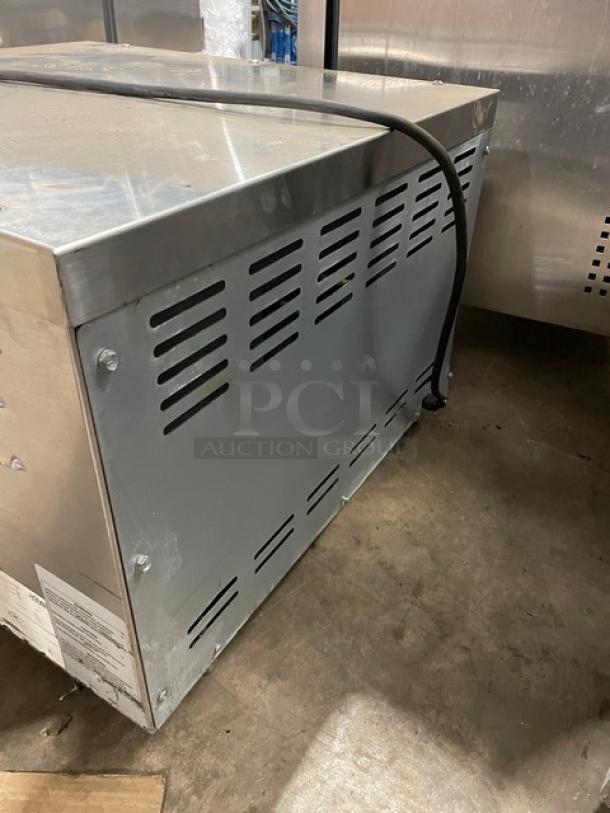 Asber AEPO Series commercial stainless steel electric countertop pizza deck oven, 220-240V, on legs, shown from the side.