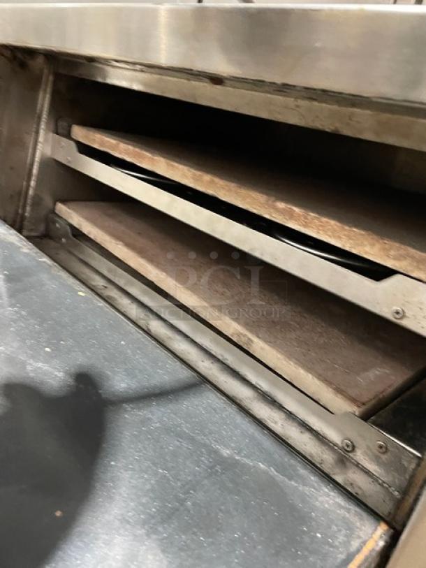Asber AEPO Series stainless steel countertop pizza deck oven, 220-240V, with visible deck, on legs, used condition.