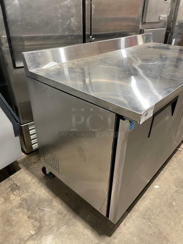 True TWT-60 commercial stainless steel 2-door worktop refrigerator with backsplash, poly-coated rack, and casters. Energy Star certified.