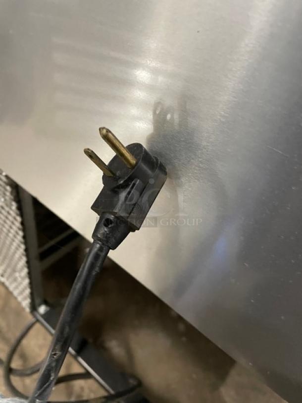 True TWT-60 stainless steel 2-door worktop refrigerator, Energy Star certified, with backsplash, poly-coated rack, 115V, on casters.