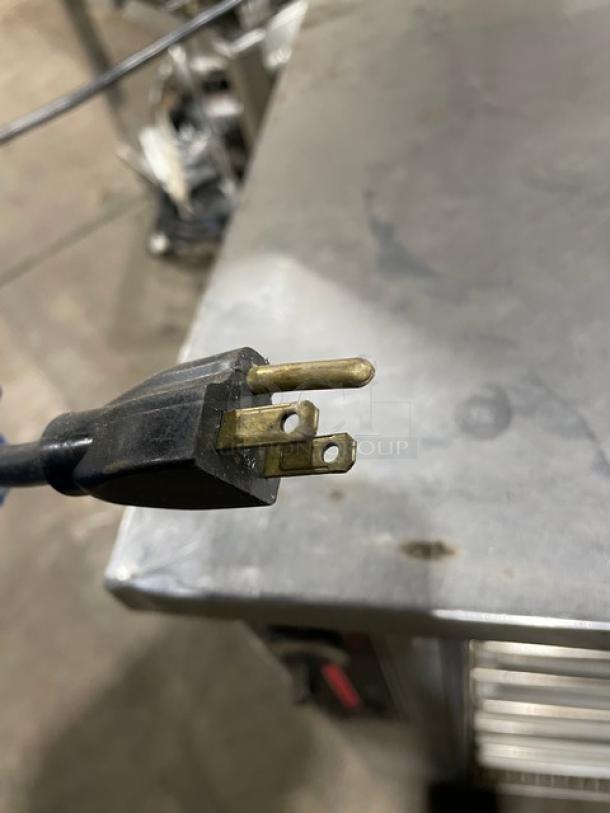 FWE Commercial stainless steel warming cabinet, model HLC-SL1826-8-CHP, with wired racks and casters. 120V plug shown.