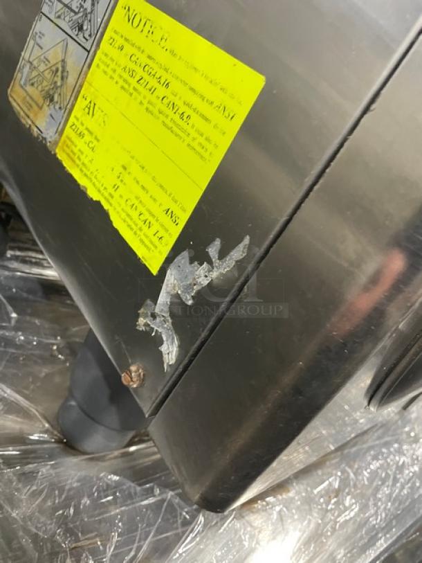 Rational SelfCooking Center Series stainless steel combi oven with built-in pan slide. Visible wear and labels.