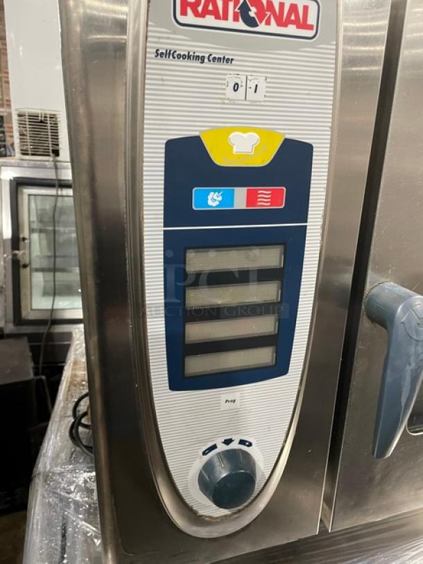 Rational SelfCooking Center commercial combi oven, stainless steel, with built-in pan slide, digital controls, on legs, used condition.