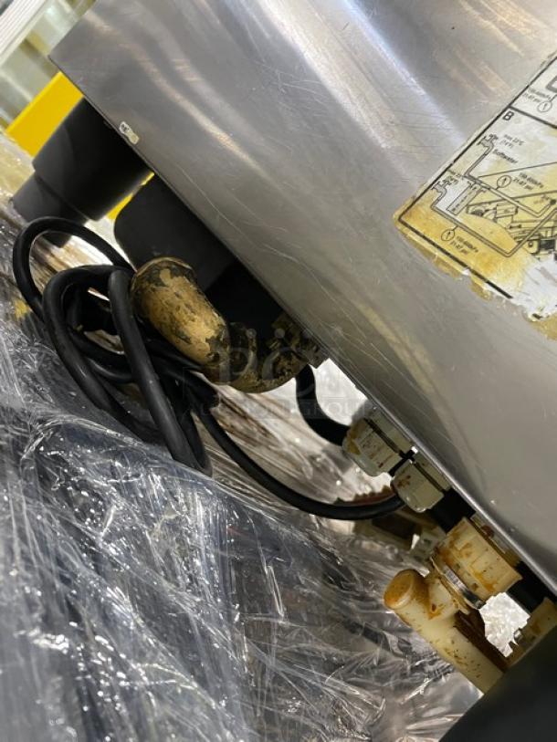 Rational SelfCooking Center commercial combi oven; stainless steel, built-in pan slide, on legs, visible wiring and connection.