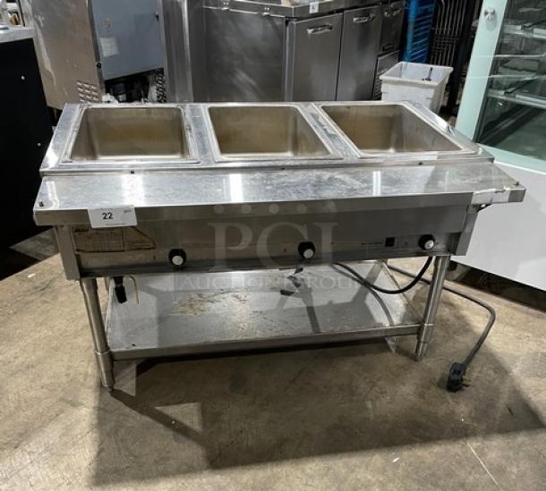 Eagle Group stainless steel 3-well hot food table with tray slide, single undershelf, on legs, electric powered, commercial-grade.