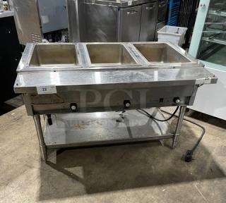 Eagle Group stainless steel 3-well hot food table with tray slide, single undershelf, on legs, electric powered, commercial-grade.