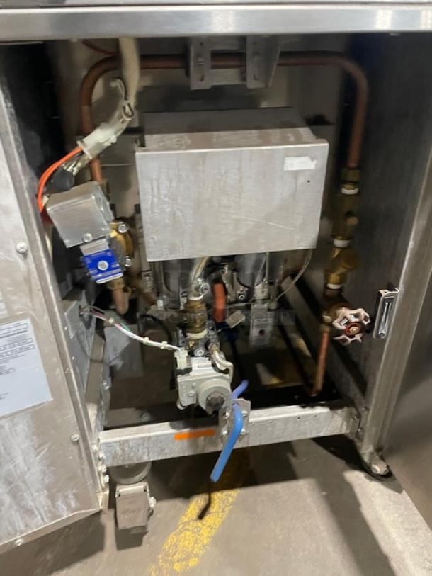 Pitco SRTG commercial stainless steel natural gas pasta cooker, 17.5 gal capacity, 3-bay with backsplash, on casters.