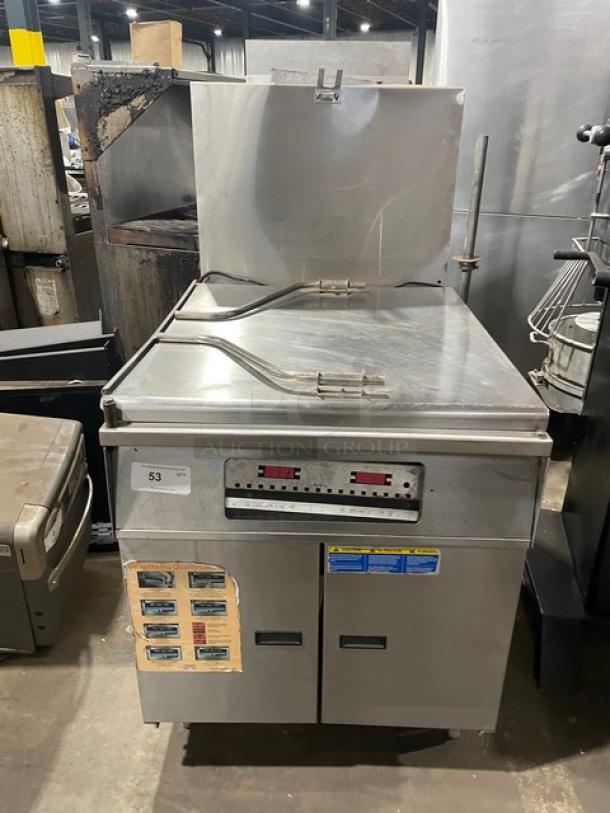 Pitco DD24RUFM commercial stainless steel donut fryer, 117 lb. capacity, natural gas, with backsplash, on legs, model SN: G05CB006855.