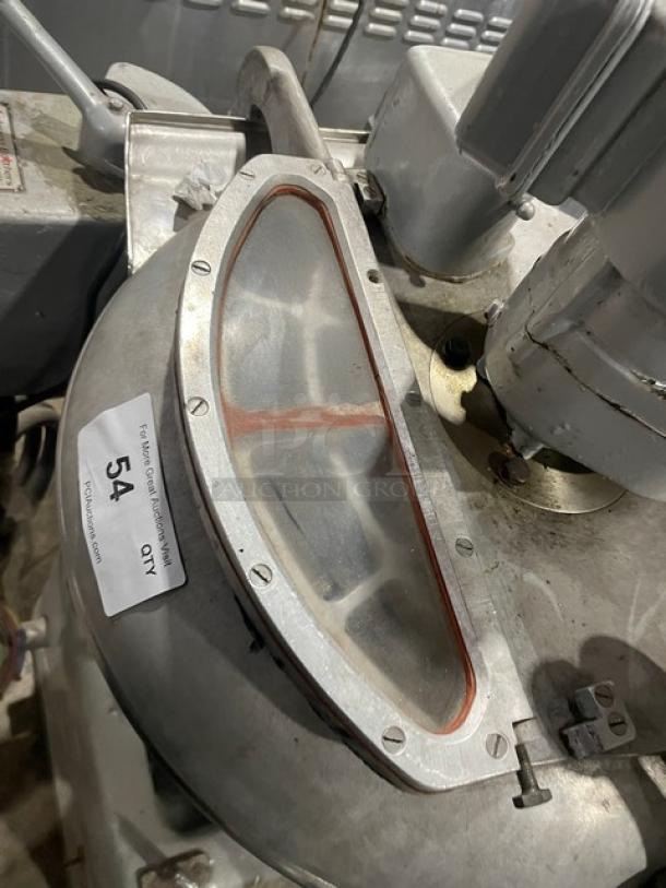 Hobart Model VCM40 commercial mixer with stainless steel tilting bowl and lid. Visible label: "54". Suitable for heavy-duty use.