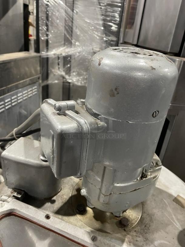 Hobart VCM40 commercial electric mixer, heavy-duty, 40 qt capacity, stainless steel tilting bowl, visible wear.