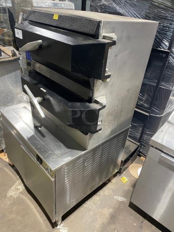 Cleveland Range stainless steel 2-compartment pressure steamer, natural gas powered, with controls, pan slides, and enclosed base.