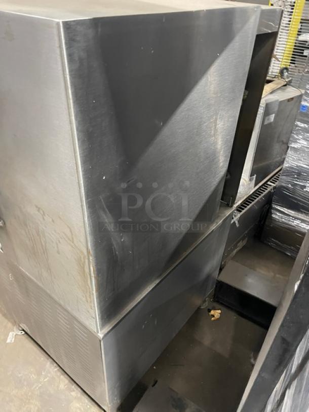 Cleveland Range commercial stainless steel natural gas 2-compartment pressure steamer, individual controls, enclosed cabinet base, on legs.