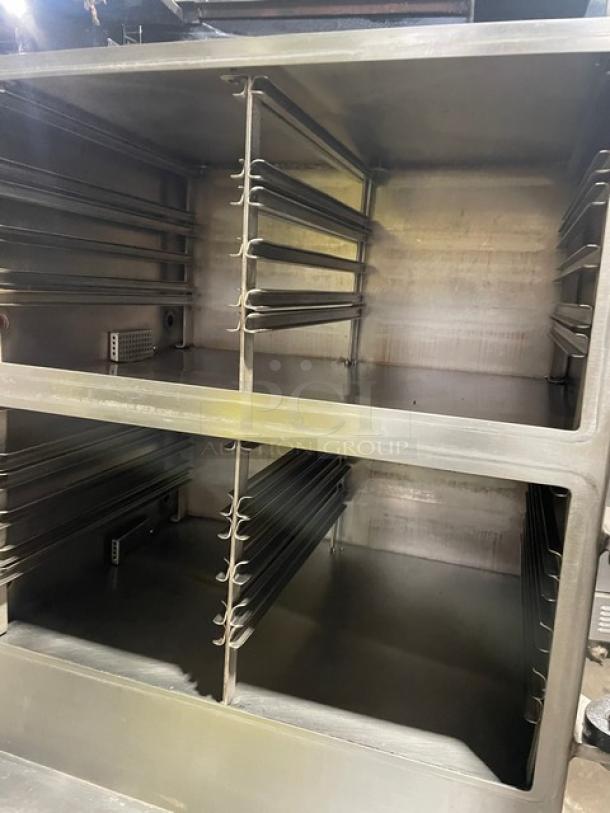 Cleveland Range stainless steel 2-compartment pressure steamer, natural gas, with individual controls, built-in pan slides, cabinet base.