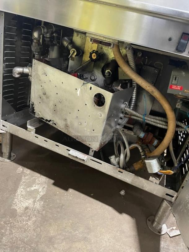 Cleveland Range stainless steel 2-compartment pressure steamer with individual controls, built-in pan slides, and cabinet base.