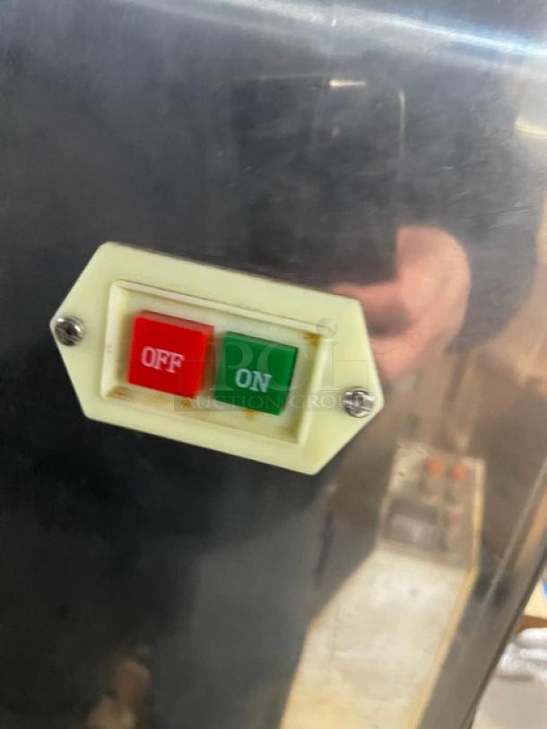 Stainless steel electric meatball forming machine with on/off switch, 220V, 3-phase. Appears in used condition.