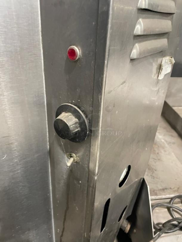 Groen AH/1-40 stainless steel 40-gal. steam kettle, natural gas, with swing spout faucet, control knob, on legs.