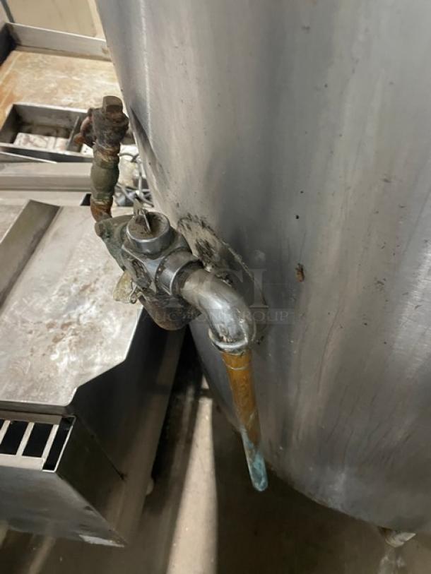 Groen AH140 stainless steel 40-gallon steam kettle with swing spout faucet, natural gas, on legs, visible wear.