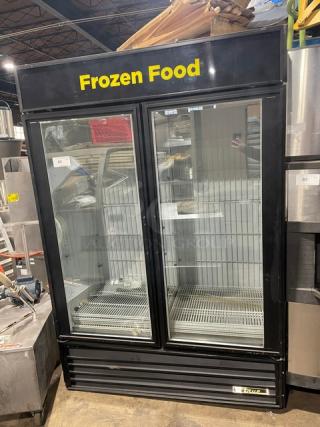 True Commercial Double Glass Door Freezer Model GDM-49F in black, with poly-coated wired racks. Marked "Frozen Food."