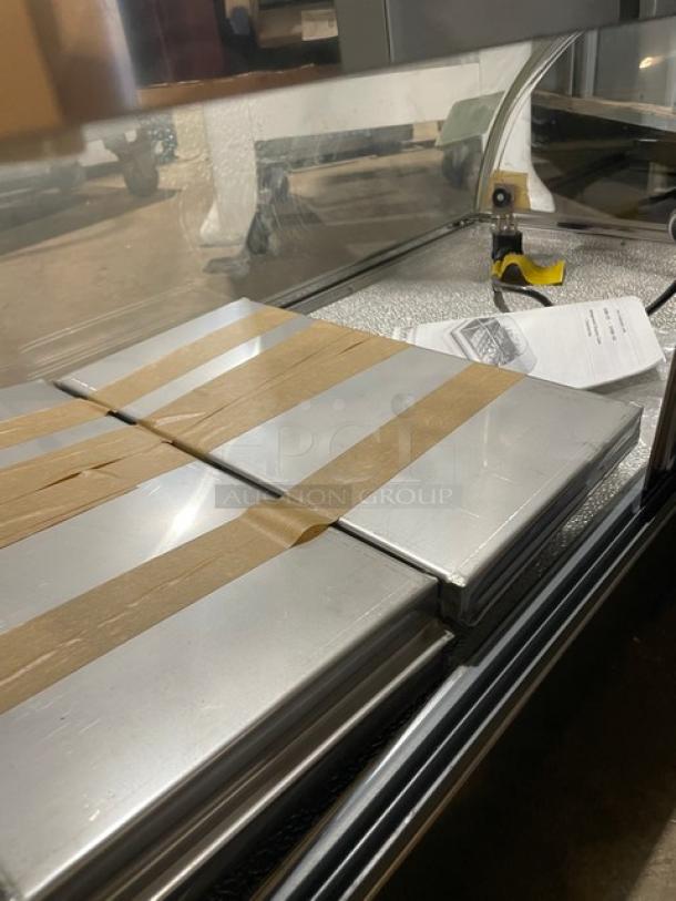 Diamond GVRB-120 stainless steel sushi display case with curved glass, rear sliding doors, and new condition. Model tag visible.