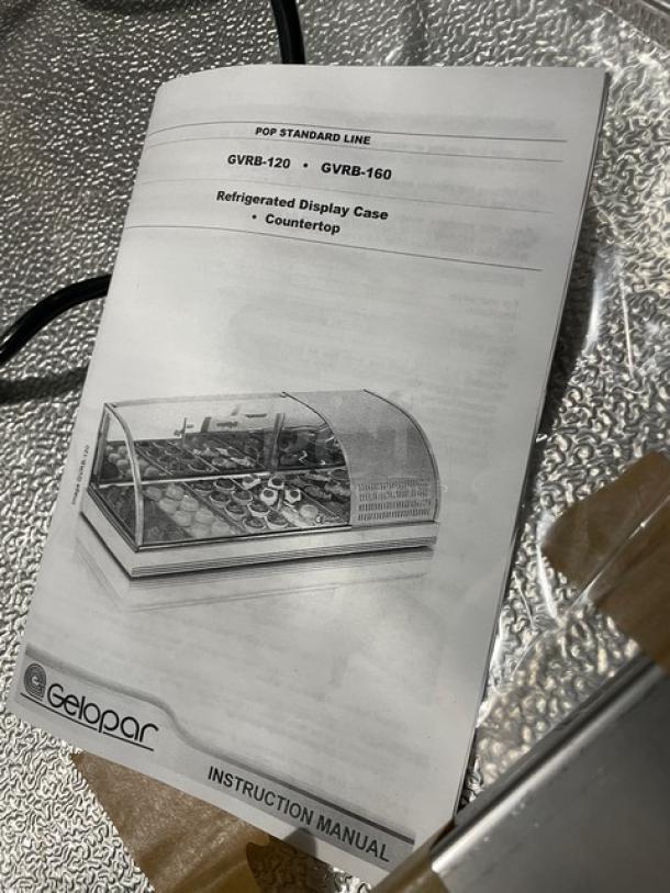 Diamond curved glass sushi display case instruction manual, Model GVRB-120, shown on textured surface.