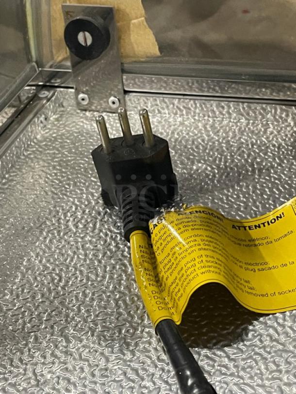 Diamond GVRB-120 sushi display case plug, showing attached caution label. New condition, stainless steel. Model: GVRB-120.