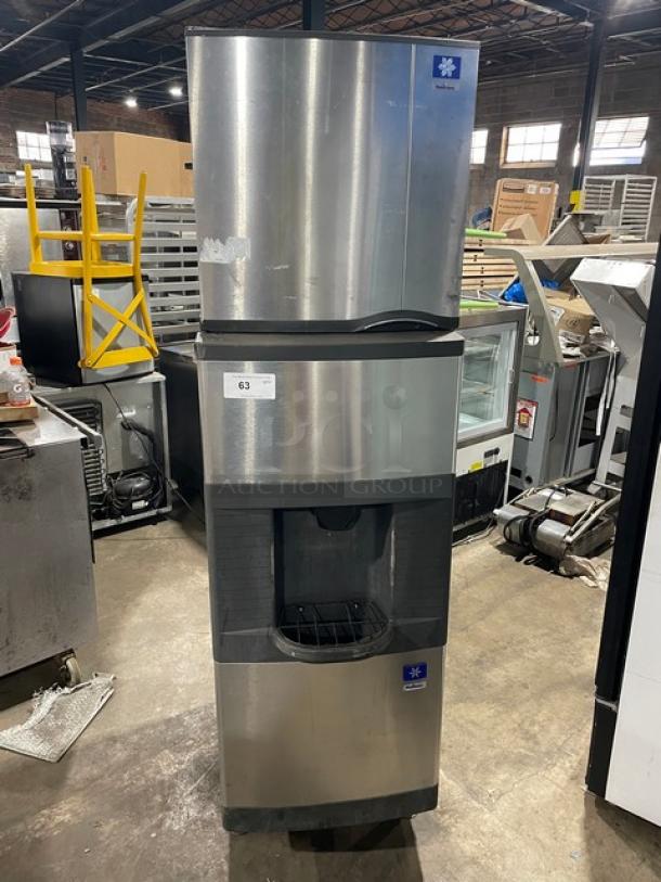 Manitowoc stainless steel ice machine, model SD0423W/QPA160. Water-cooled, electric powered, storage bin, on legs.