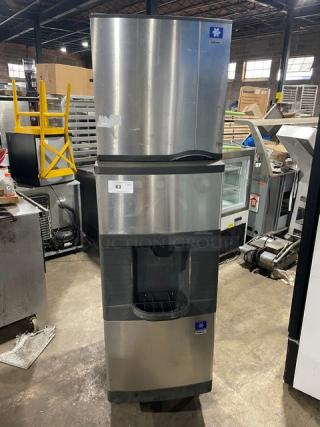 Manitowoc stainless steel ice machine, model SD0423W/QPA160. Water-cooled, electric powered, storage bin, on legs.